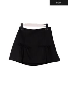 Black / S/M Chic Bow Mini Skirt For Spring, Black Pleated Hem Tennis Skirt For Summer, Preppy Summer Workwear Skort, Black Mini Skort With Pleated Waist, Black Pleated Waist Mini Skort, Black Pleated Hem Tennis Skirt For Spring, Mini Skirt With Bow Detail, Chic Black Skort With Pleated Hem, Summer Mini Skirt With Bow Detail