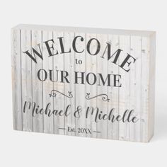 a wooden sign that says welcome to our home