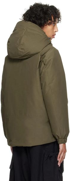 Snow Peak.Khaki 2 Layer Down Jacket.Down-filled 2L recycled polyester- and aramid-blend ripstop jacket. Fire-resistant, wind-resistant, and waterproof..· Bungee-style drawstring at detachable hood.· Throat guard at hood.· Funnel neck.· Two-way zip closure with press-stud placket.· Zip pocket and welt pockets.· Logo bonded at front hem.· Bungee-style drawstring at hem.· Raglan sleeves.· Elasticized cuffs.· Mesh patch pocket at interior.· Full quilted taffeta lining.Supplier color: Olive.Fill: 90% Mountain Jacket, Heeled Rain Boots, High Heel Rain Boots, Studded Jacket, Khaki Jacket, Snow Peak, Womens Khakis, Black Down, Detachable Hood