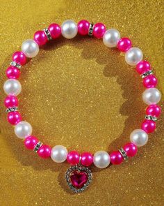 Elegant handmade pearl necklace made of Pink and white beads with a diameter of 8 mm and 10 mm.  The necklace is decorated with aheart with pink stone.  It is fastened with an elastic thread , which makes it easy to remove and put on the necklace, and if the dog catches on it, it will not create problems. There are three necklace sizes available 20 cm (8 inches), 25 cm (10 inches), 30 cm (12 inches).  If necessary, I can create a necklace according to your size.  The pendant is a heart with pink stone, size 1.5 by 1.5 cm . The diameter of the beads is 8 mm and 10 mm. The necklace is intended only as a decoration .  Before ordering, measure the animal's neck along the entire length, taking into account the free fit on one or two fingers. Pink Pearl Necklace With Heart Beads, Pearl Necklace With Heart, Necklace For Dogs, Handmade Pearl Necklace, Jewellery Luxury, Three Necklaces, Pearl Collar, Necklace With Heart, Pink Pearl Necklace