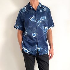 Funky vintage summer shirt in navy blue floral and geometric print. It has short sleeves, a single chest pocket and an open v-neck collar. Perfect with beach shorts or tucked into high waist trousers for a flower power look. Made in California by Mr. Jan. 100% polyester, sateen weave (smooth and silky on the outside). XL size, but fits as relaxed Medium to XL being tight. Measurements when laid flat are: Pit to pit: 64cm Waist: 58cm Length: 72cm Excellent condition. E Black Macrame, 70s Vintage, Shirt Short Sleeve, Beach Shorts, Mens Navy, Vintage Summer, Navy Floral, High Waisted Trousers, Neck Collar