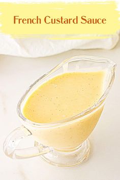 a glass gravy dish with mustard in it and the words french custard sauce above it