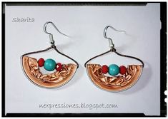 the earrings are made with copper and turquoise beads