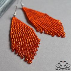 These orange beaded earrings are made of high-quality Czech beads and strong synthetic thread. They are elegant, fashionable, and highly versatile, suitable for everyday wear. Features: Sterling silver components Color: orange. This item is currently in stock. You must be completely satisfied. If you find merchandise unsatisfactory for any reason, return it within 10 days and your money will be refunded without questions. These earrings in gold color https://www.etsy.com/listing/660046267/gold-b Handmade Elegant Orange Beaded Earrings, Elegant Handmade Orange Beaded Earrings, Orange Beaded Earrings For Parties, Orange Round Beaded Earrings For Party, Elegant Orange Beaded Earrings As A Gift, Elegant Orange Earrings With Dangling Beads, Elegant Orange Beaded Dangling Earrings, Orange Beaded Earrings With Dangling Beads For Party, Orange Beaded Dangling Earrings For Party