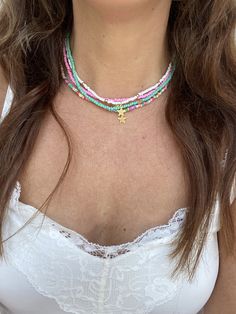 Gorgeous festival and summer ready chokers. These are small seed beaded choker necklaces with various different options available -  multicoloured with 1 star multicoloured with 5 stars pink with a moon charm pink with a heart charm green with a starfish charm white and gold with 1 star green with 5 gold shells If you would prefer a different combination of bead necklace and charm simply message me and I can make you one to order! Options are also available to just buy the necklace with no charm. Clasps, chains and charms are all gold coloured. The pendants measure 0.5cm across and 1cm tall apart from the moon which is slightly longer at 1.2cm. The chokers are approximately 38cm long but they have an extender chain if you prefer to wear them as a necklace rather than a choker. Multibuy opt Cheap Star-shaped Beaded Necklaces For Gifts, Charm Choker Necklace, Green Star, Festival Summer, Beaded Choker Necklace, Moon Charm, Choker Necklaces, Summer Ready, Beaded Choker