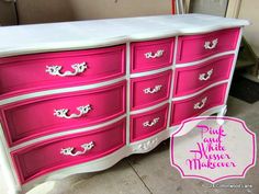 a pink and white dresser with silver trim on it's drawers is shown in this image