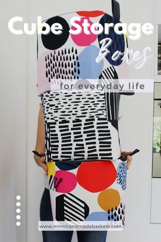 a woman standing in front of a white wall with the text cube storage ideas for everyday life