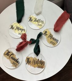 six wine glass coasters with the names of four different wines on them sitting on a white table