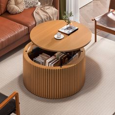 a living room filled with furniture and a coffee table in the middle of the room