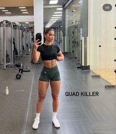 a woman taking a selfie in the gym