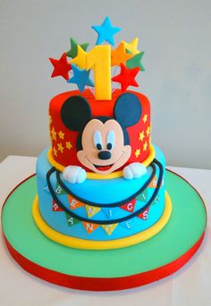 a mickey mouse birthday cake with stars on top