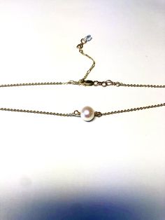 Stunning and made by hand with a real freshwater pearl in ivory white and adorned with Swarovski rhinestone rondelles and Swarovski AB crystals. Made with pure sterling Silver or 14K gold fill chain, with no open jump rings, ensuring strength and durability.Made 14” with 2" adjustable clasp, to be worn for layering at different lengths and Swarovski dangle down the back. Gold filled metal is highly superior to "gold plated" as it is non-tarnish, can be worn in water, and is hypoallergenic. Rondelle Pearl Chain Jewelry As Gift, Rondelle Pearl Chain Jewelry, Dainty Single Strand Akoya Pearl Jewelry, Dainty Adjustable Pearl Necklace For Anniversary, White Hypoallergenic Akoya Pearl Jewelry, Pearl White Rondelle Jewelry With Pearl Drop, Adjustable Akoya Pearl Drop Jewelry, Gold Rondelle Pearl Necklace As Gift, Pearl Jewelry Rondelle Shape For Gift