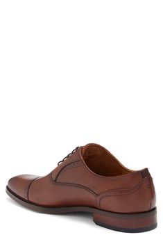 The Florsheim Sorrello Cap Toe Oxford features a modern, tapered toe, and rich burnished finish. Featuring breathable, full leather uppers, breathable suedetec linings, a fully cushioned footbed, and flexible rubber sole. Lace-up vamp Leather upper, rubber sole Imported Classic Brown Snip Toe Oxfords, Brown Leather Lined Derby For Business, Brown Leather-lined Derby Shoes For Business, Business Brown Derby Shoes With Leather Lining, Brown Leather Lined Derby Shoes For Business, Classic Brown Oxfords With Cushioned Footbed, Wingtip Leather Derby Shoes, Classic Brown Dress Shoes With Cushioned Footbed, Brown Derby Shoes With Leather Footbed For Business