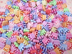 a pile of colorful plastic beads on a table