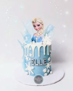 a frozen princess cake with icing and snowflakes