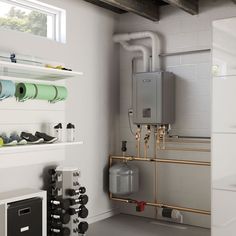 a room with pipes, water heater and other items on the wall in it