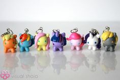 several little toy elephants are lined up in a row