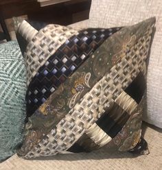 a decorative pillow is sitting on a couch