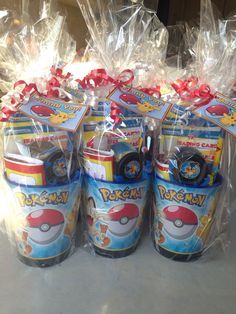 four plastic cups with pokemon toys in them