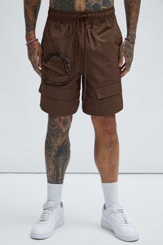 Available In Brown. Drawstring Elastic Waist Side Hand Pockets Back Pocket Utility Pockets 1 Zipper Pocket Shell: 100% Nylon Imported | Mens Safe Side Utility Nylon Shorts in Brown size Large by Fashion Nova Outdoor Nylon Shorts With Drawstring, Nylon Drawstring Shorts For Outdoor, Streetwear Nylon Cargo Shorts With Multiple Pockets, Utility Shorts With Drawstring For Streetwear, Nylon Cargo Shorts With Multiple Pockets For Streetwear, Utility Drawstring Shorts For Streetwear, Utility Style Drawstring Shorts For Streetwear, Nylon Cargo Shorts For Streetwear, Urban Nylon Bottoms With Functional Drawstring