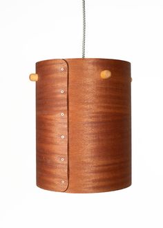 a wooden lamp hanging from a metal chain