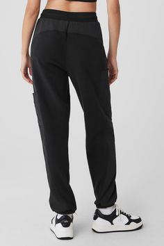 Made from a fleecy-soft fabric with smooth, contrasting panels down the legs, these pants are every bit as cozy as they look. They have a total of 4 pockets—2 on the sides, 2 on the legs—plus a stretchy high-rise waistband and stretchy cuffed hems for a jogger-style fit. Our advice? Get the matching jacket, too. Sporty Alo Yoga Bottoms, Alo Yoga Sports Bottoms With Elastic Waistband, Black Sweatpants With Pockets And Straight Hem, Sporty Full Length Sweatpants With Cargo Pockets, Sporty Straight Joggers With Pockets, Black Bottoms With Elastic Side Panels For Work, Sporty Black Alo Yoga Bottoms, Sporty Alo Yoga Bottoms With Comfort Waistband, Alo Yoga Sporty Black Bottoms