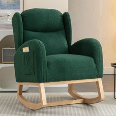 a green rocking chair in a living room