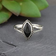 Sterling Silver & Synthetic Onyx Marquise Ring Color: Sterling Silver & Black Onyx Material: .925 Silver Size: 6mm W, 10mm H Black Sterling Silver Stackable Jewelry, Stackable Black Sterling Silver Jewelry, Marquise Ring, Ring Color, Black Rings, Womens Jewelry Rings, Black Onyx, Jewelry Crafts, Black Silver