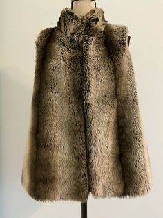 Kenar faux fur vest Size S. Brown Sleeveless Vest With Faux Fur Lining, Sleeveless Fur Coat With Faux Fur Trim, Sleeveless Faux Fur Coat With Fur Trim, Sleeveless Faux Fur Coat, Sleeveless Mink Outerwear With Faux Fur Lining, Winter Faux Fur Vest With Fur Trim, Sleeveless Fur Coat With Faux Fur Lining For Fall, Winter Faux Fur Vest With Trim, Sleeveless Mink Outerwear For Winter