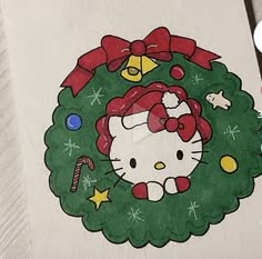 a drawing of a hello kitty christmas wreath