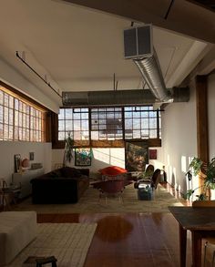 an empty living room with lots of windows