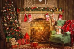 a living room decorated for christmas with stockings on the fire place and presents around the fireplace