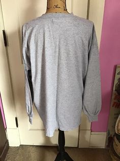 "Vintage 1990's Y2K long sleeve Tee Shirt with *GRUMPY* on it. Gray in color. Made of 90% Cotton and 10% Polyester. Tagged size XL. Go by the measurements below. *MORE INFORMATION BELOW* CONDITION: No issues noted. MEASURES: Chest/Bust~48\" Bottom edge~52\" Sleeve length~21\" Shoulder seam to shoulder seam~23\" Back of collar to bottom~29\" *WE APOLOGIZE~BUT WE NO LONGER SHIP TO GERMANY, ITALY OR SPAIN. IF ORDERS COME IN FROM GERMANY, ITALY OR SPAIN, WE WILL HAVE TO CANCEL THEM AND REFUND YOUR M Vintage Clothing Boutique, Y2k Long Sleeve, Long Sleeve Tee Shirt, Long Sleeve Tee Shirts, Shirt Long Sleeve, Vintage 1950s, Long Sleeve Tee, Tee Shirt, Long Sleeve Tees