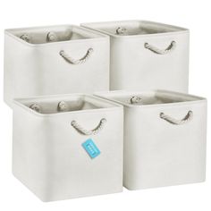 three white storage bins with handles and tags