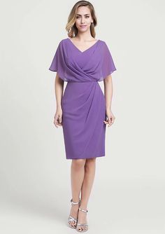 a woman wearing a purple dress with an asymmetrical neckline and short sleeves