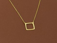 Elevate your jewelry collection with our 14k Gold Open Square Necklace--a minimalist masterpiece that embodies balance and simplicity. This open square pendant, crafted from high-quality 14k solid gold, represents stability and symmetry, making this necklace more than just an accessory; it's a meaningful piece that aligns with modern aesthetics. Ideal as a thoughtful gift for someone who values simplicity, or as a treat for yourself to add a timeless piece to your daily wardrobe. --------------------♡-------------------- Features: ❤Made to Order ❤Handmade item ❤Dispatches from a Mother-Owned Small Business ❤Ready to Ship in 1-3 Business Days ❤Dimensions: Width 10mm x Height 10mm ❤Closure: Spring ring ❤Chain style: Cable ❤Style: Minimalist // Modern // Casual Chic   ❤Two fundamental choices Print Top, Square Necklace, Square Pendant, Soft Bristle Brush, Geometric Jewelry, Chain Ring, Christmas Gifts For Her, Spring Rings, Timeless Pieces