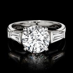 Ross-Simons - 3.60 ct. t. w. Lab Grown Diamond Ring Round Cut in 14kt White Gold. Size 5. Extraordinary in size and sparkle, our radiant three-stone ring delivers high-end glamour at an incredible value. A 3.00 carat round brilliant-cut lab-grown diamond is flanked by .60 ct. t. w. tapered baguette lab-grown diamonds and set in polished 14kt white gold. Lab-grown diamonds are identical to mined diamonds according to their optical, physical and chemical properties. All Ross-Simons lab-grown diamo Platinum Three-stone Baguette Cut Diamond Ring, Platinum Three Stone Diamond Ring With Baguette Cut, Three Stone Baguette Cut Platinum Diamond Ring, Diamond Ring Round, Physical And Chemical Properties, Pure Design, Diamond Birthstone, Three Stone Rings, Ring Diamond