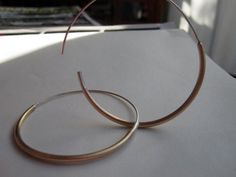 You Choose Which Hoop Size is Right For You - From 1" to 3.5" These earrings are incredibly lightweight and great to wear for everyday. They are simple and thin with a deep honey brass on the bottom of the hoop and the ear wire is sterling silver. + Material - Brass, Solid Sterling Silver, & Solid 14k Gold + Hoop Diameter Sizes - 1", 1.25", 1.5", 1.75", 2", 2.25", 2.5", 2.75", 3", 3.25", 3.5" + Hoop Thickness (Thick Part) - 2mm Diameter + Hoop Shape - Round + Brass & Sterling Silver Hoop Ear Wire Material - Sterling Silver + Brass & Sterling Silver Hoop Ear Wire Gauge - 20ga + 14k Gold Hoop Ear Wire Material - 14k Gold + 14k Gold Hoop Ear Wire Gauge - 20ga + Listing is for a pair + Packaged in a Brown Kraft Box ******NOTE******* The 14k Gold is a SOLID 14k gold! The 2mm thick portion is no Brass Hoops, Honey Colour, Large Hoop Earrings, Large Earrings, Jewelry Cleaner, Sterling Silver Hoops, Gold Hoops, Gold Hoop, Silver Hoops