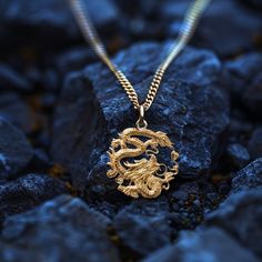 Introducing our captivating 14k Gold Dragon Pendant, a masterpiece of fantasy-inspired jewelry. This solid gold dragon necklace is a symbol of strength and mystique, meticulously crafted to showcase the intricate details of this mythical creature. Our Gold Dragon Pendant is a unique piece of artistry, handcrafted in 14 karat gold. PENDANT INFORMATIONThis pendant is made of real, solid gold.• Made in USA• Material: 14k or 18k solid gold• Finish: polished• Height: 1.2" (30,5 mm) | *includes the sm Dragon Design Amulet Jewelry As Gift, Dragon Design Amulet Jewelry Gift, Amulet Jewelry With Dragon Design For Gift, Spiritual Dragon Design Pendant Jewelry, Spiritual Gold Jewelry With Dragon Design, Symbolic Dragon Design Round Pendant Necklace, Yellow Gold Dragon Pendant Jewelry, Yellow Gold Dragon Design Pendant Jewelry, Dragon Design Pendant Amulet Jewelry