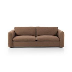 a brown couch sitting on top of a white floor