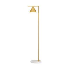 a gold floor lamp with a white base