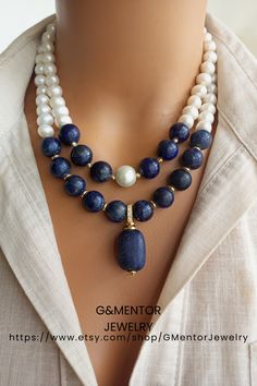 A timeless accessory that embodies natural beauty, our elegant Pearl and Lapis Lazuli Necklace combines lustrous freshwater pearls, known for their lustrous and iridescent appeal, with the deep blue appeal of genuine Lapis Lazuli gemstones. Handmade with love and attention to detail, this stunning necklace exudes a sense of opulence and elegance. Formal Lapis Lazuli Beaded Necklace, Elegant Beaded Necklaces With Stones For Gift, Elegant Round Lapis Lazuli Beaded Necklaces, Elegant Stone Necklace For Anniversary, Elegant Round Lapis Lazuli Beaded Necklace, Elegant Round Beaded Lapis Lazuli Necklace, Formal Lapis Lazuli Necklace With Round Beads, Exquisite Gemstone Bridal Necklace, Elegant Handmade Double Strand Crystal Necklaces