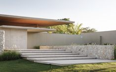 an outdoor area with steps leading up to a building that is made out of stone