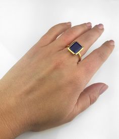 This beautiful bezel set ring is made with large rectangular faceted natural Blue Jade in 18K Vermeil Gold. The ring has a 925 stamp. Gemstone size is 13 x 18 mm. Please specify your size at checkout. Since I use natural gemstones, the stones may vary slightly in color, shape and size. Due to the nature of this stone there are natural inclusions and small internal cracks. This ring is available in two finishes: ✦ 18K VERMEIL GOLD ✦ BRIGHT STERLING SILVER Please leave me a note at checkout which Rectangular Sapphire Promise Ring, Elegant Blue Jewelry With Smooth Bezel, Elegant Sapphire Ring With Smooth Bezel As Gift, Rectangular Gemstone Signet Ring In Fine Jewelry Style, Fine Jewelry Sapphire Ring With Smooth Bezel For Gift, Fine Jewelry Sapphire Ring With Smooth Bezel, Rectangular 14k Gold Emerald Ring As Gift, Minimalist Sapphire Ring With Bezel Setting As Gift, 14k Gold Rectangular Emerald Ring Gift