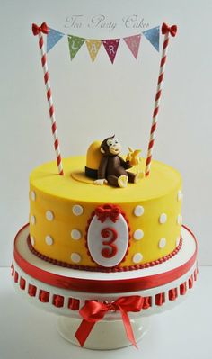 a birthday cake with a monkey on top