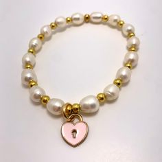 Can you think of a sweeter Mother's Day or Mom's birthday gift? A beading kit for two, this fun and simple kit includes freshwater pearls, gold plated beads and charms, enough to make one 6.5 inch and one 5.5 inch bracelet. Elastic cord, crimp covers, instructions and 2 organza pouches also included. Heart Pearl Bracelet, Mom's Birthday Gift, Mala Making, Bracelet Beading, Mother's Day Jewelry, Red Creek Jasper, Bracelet Kit, Earring Kit, Mom's Birthday