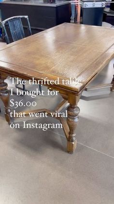 a wooden table sitting on top of a hard wood floor