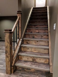 a set of wooden stairs leading up to a door