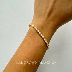 This versatile tennis bracelet is designed for everyday wear, featuring a secure lock. Crafted from genuine solid 14Kt Gold, the bracelet measures 7 inches. An ideal gift for various occasions, including Mother's Day, Valentine's Day, weddings, anniversaries, birthdays, Christmas, Easter, New Year's, and any holiday, suitable for moms, wives, fiancées, girlfriends, valentines, daughters, family, or friends. 5 carat Diamond Tennis Bracelet. Lab Grown Diamond Buttercup Setting Tennis Bracelet. Inf Ring Size Adjuster, Diamond Tennis Bracelet, Stackable Bracelets, Tennis Bracelet Diamond, Wedding Bracelet, Tennis Bracelet, Open Box, 14kt Gold, Infinity Bracelet