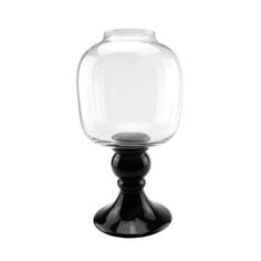 a glass vase sitting on top of a wooden stand